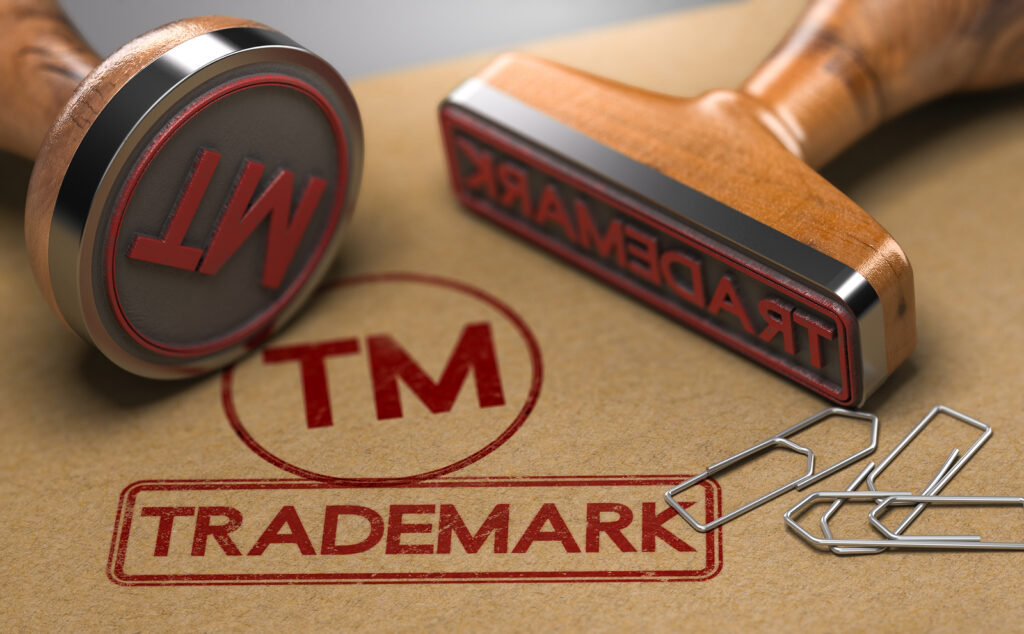 3d Illustration Of Two Rubber Stamps With The Word Trademark And